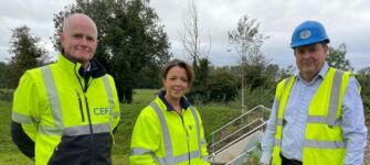 Mark Spence, Chief Executive, The Construction Employers Federation, Infrastructure Minister Liz Kimmins and David Magee, Building Director, Antrim Construction (developer of the Belmont Hall scheme)